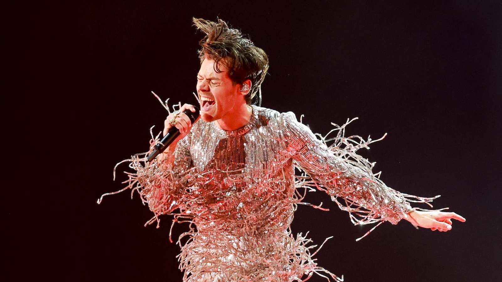 Harry Styles performing live on stage