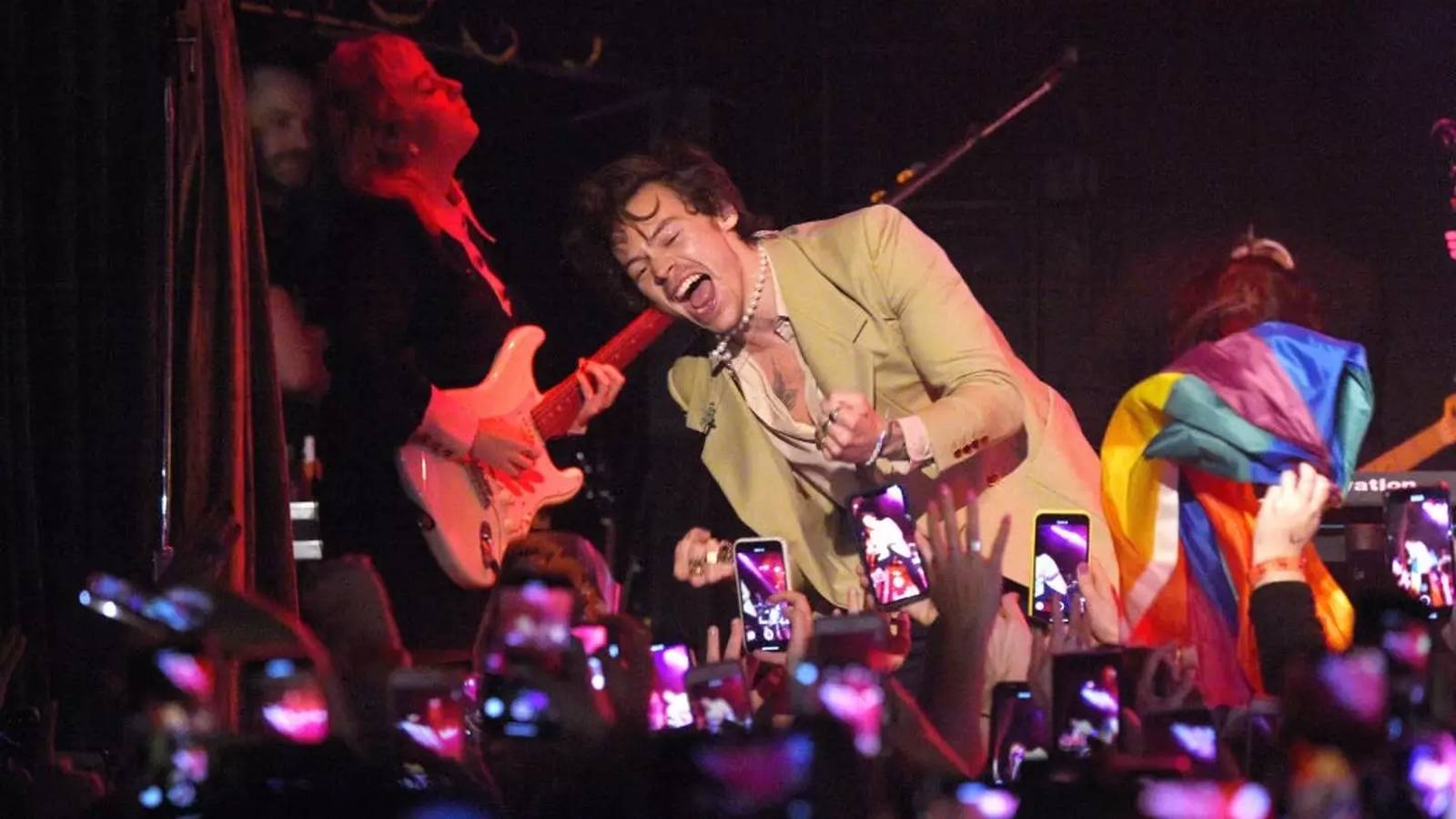 Harry Styles performing on stage