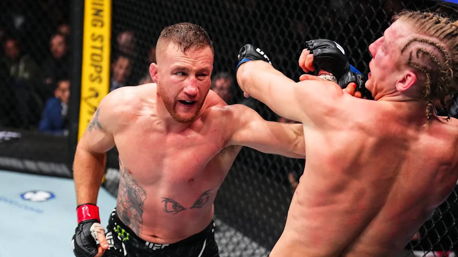 Justin Gaethje raising arms in octagon