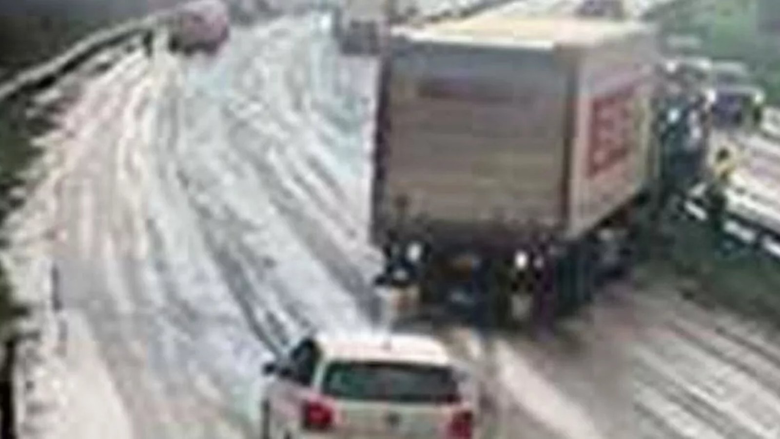 Snow-covered road in rural Wales