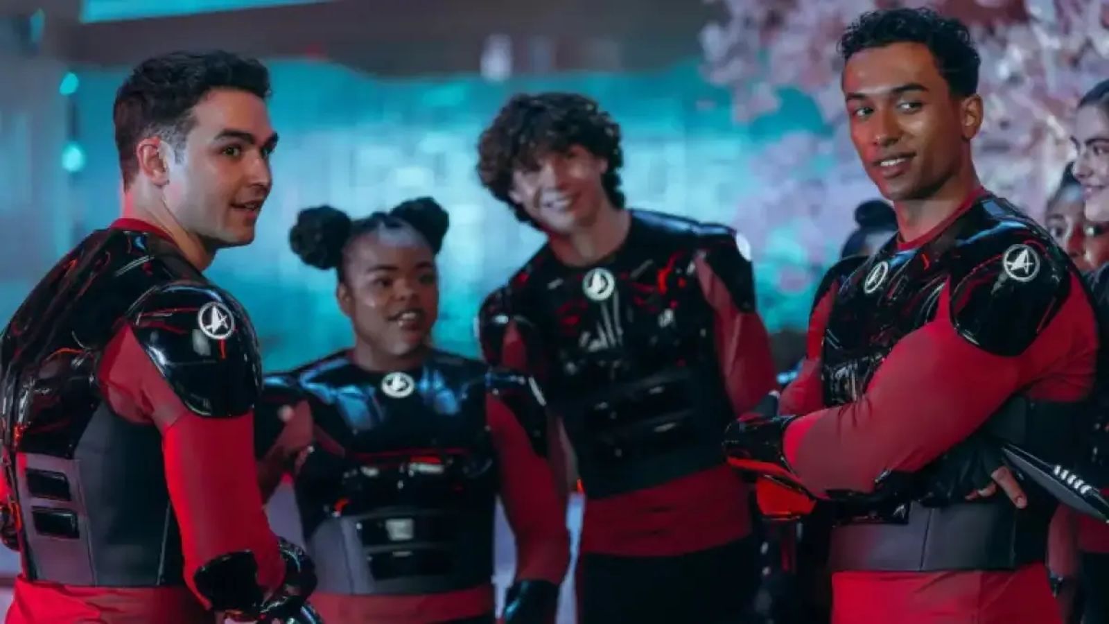 Starfleet cadets in futuristic uniforms