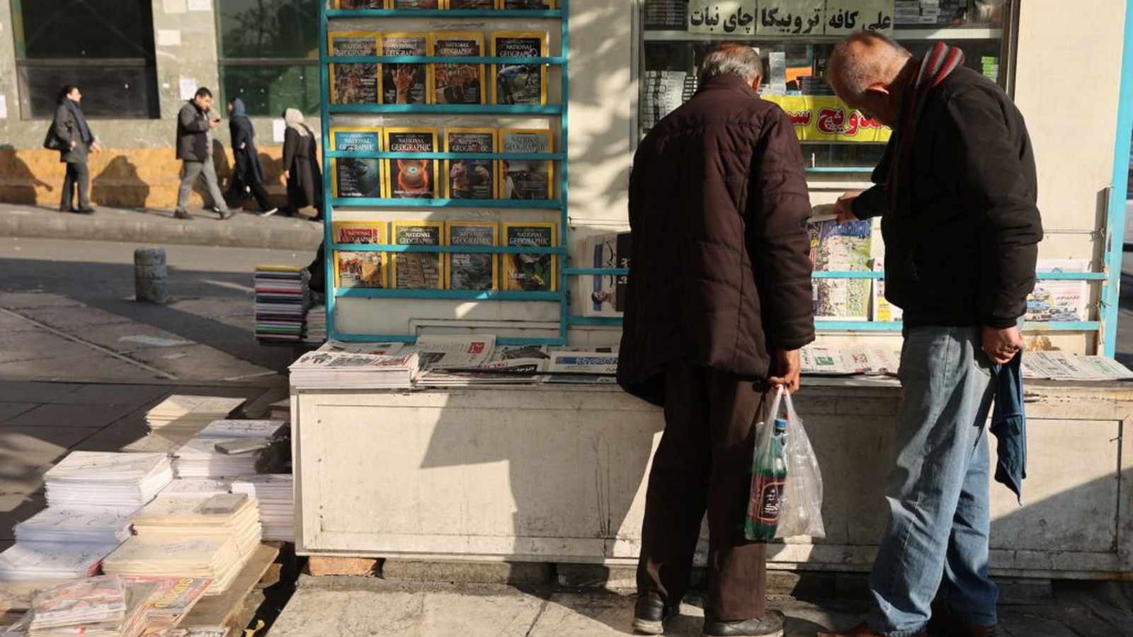 Protesters gather around bonfires in Tehran
