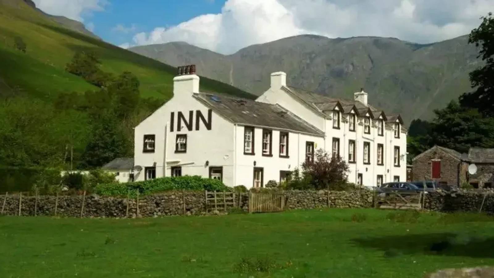 Historic Wasdale Head Inn building near mountains