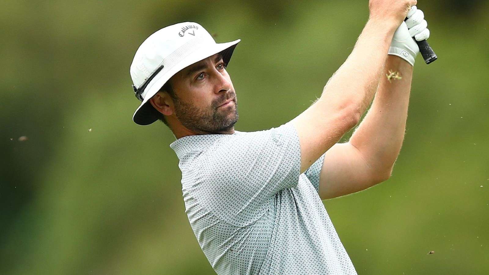 Golf ball on green with flagstick