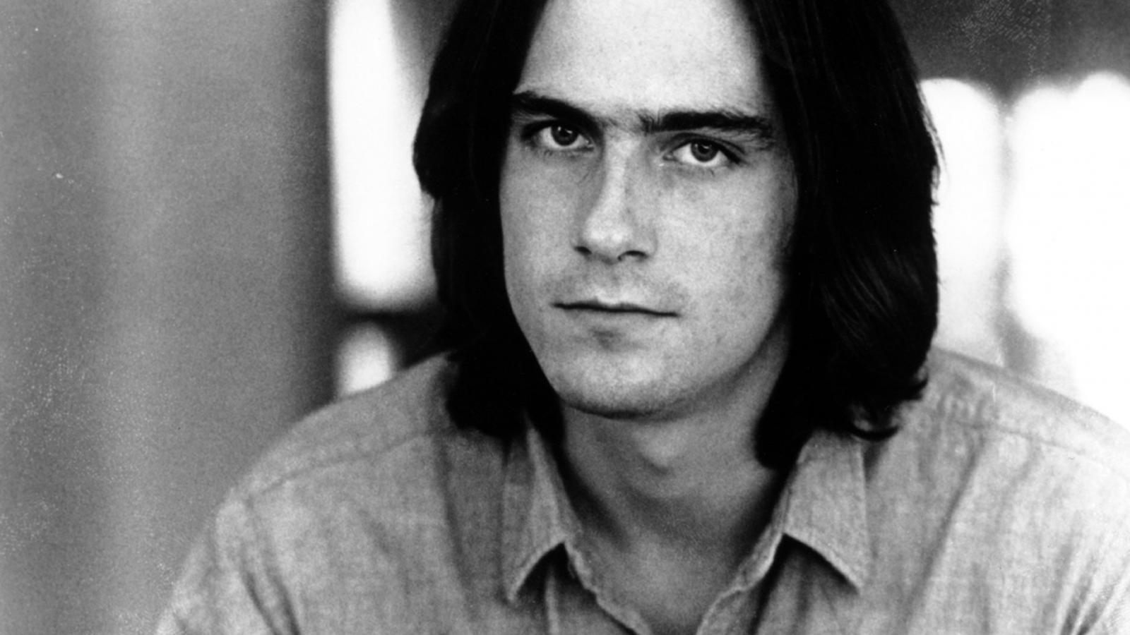 Musician James Taylor playing guitar