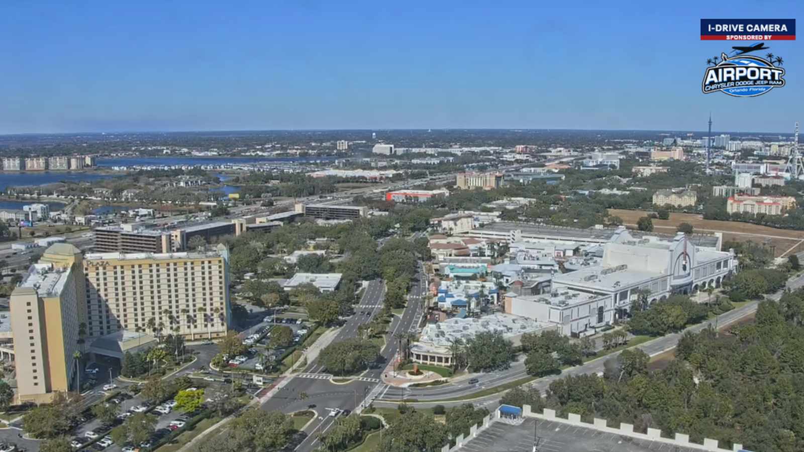 Power lines against city skyline