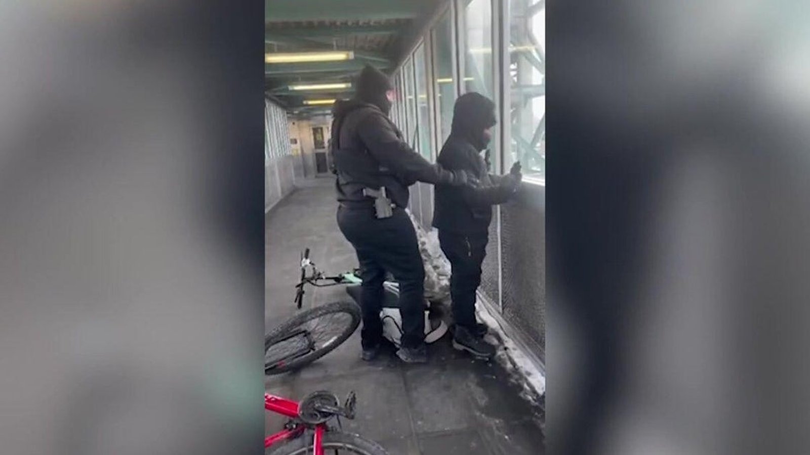 People holding signs during an anti-ICE protest