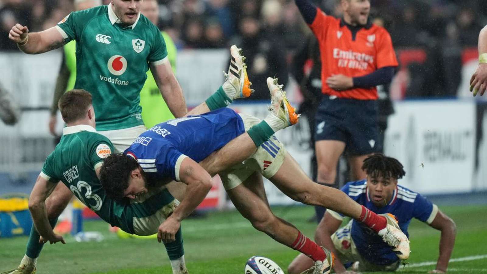Rugby players in action on field