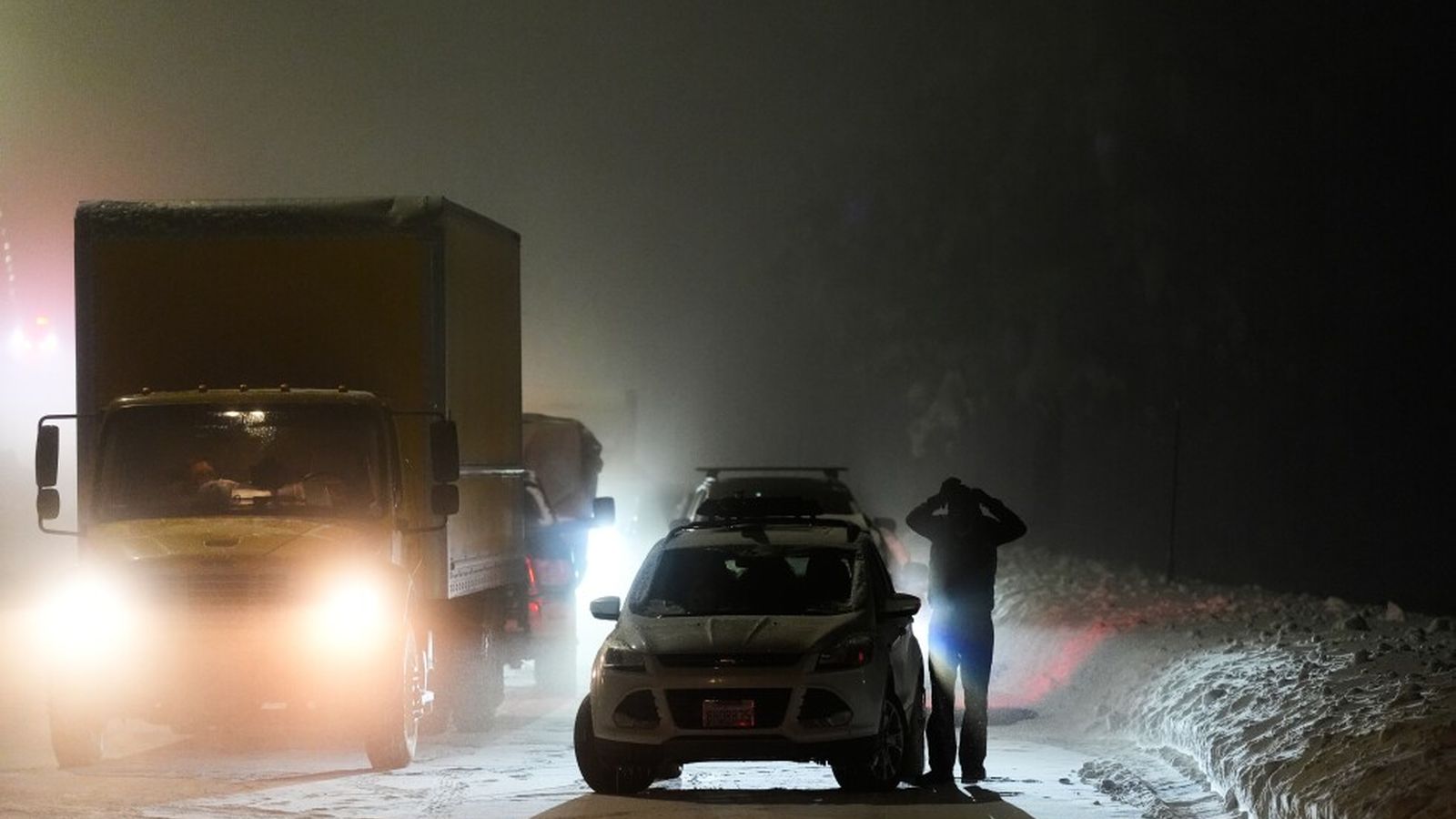 Rescue workers in deep snow