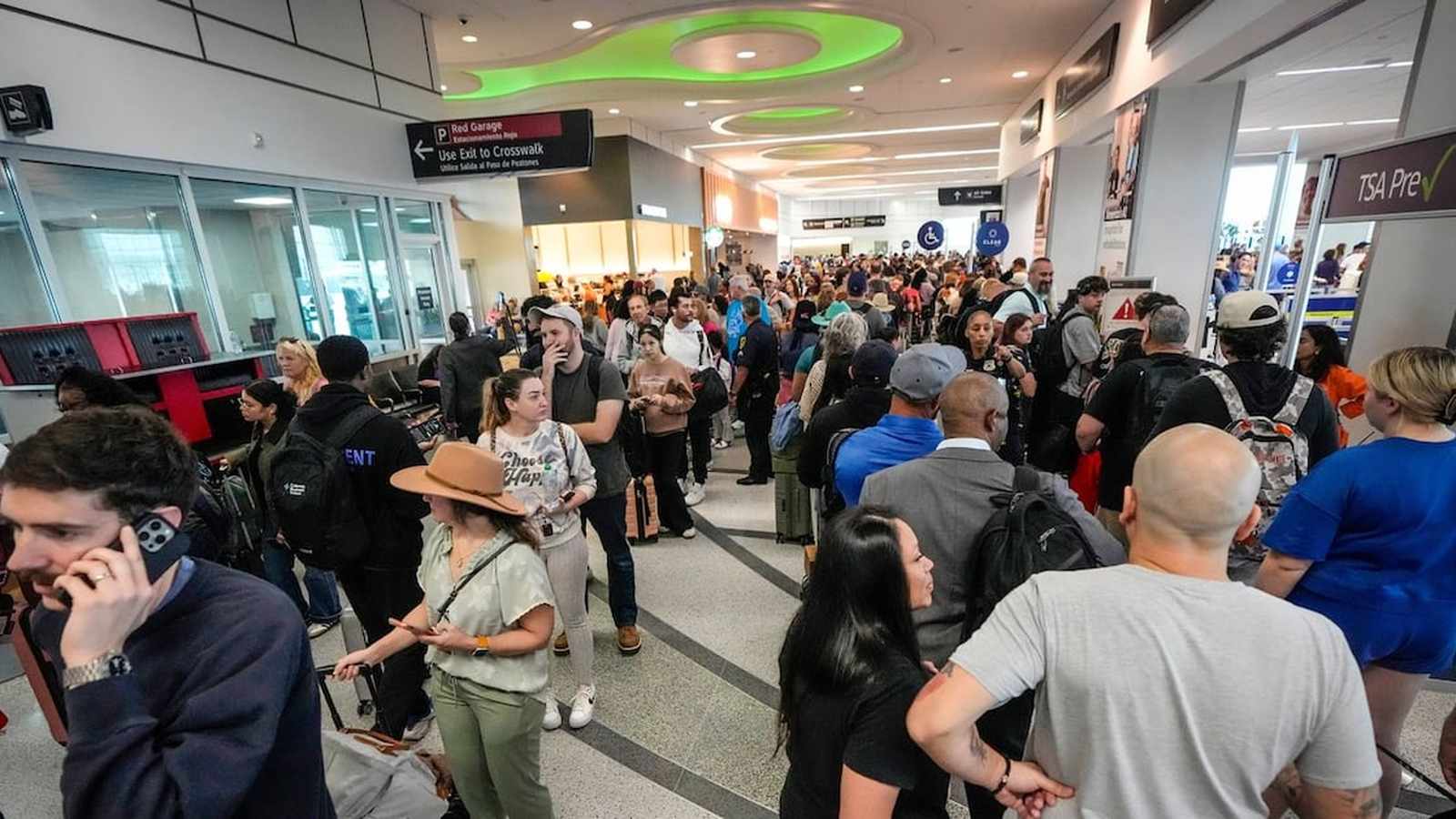 Busy airport security checkpoint line