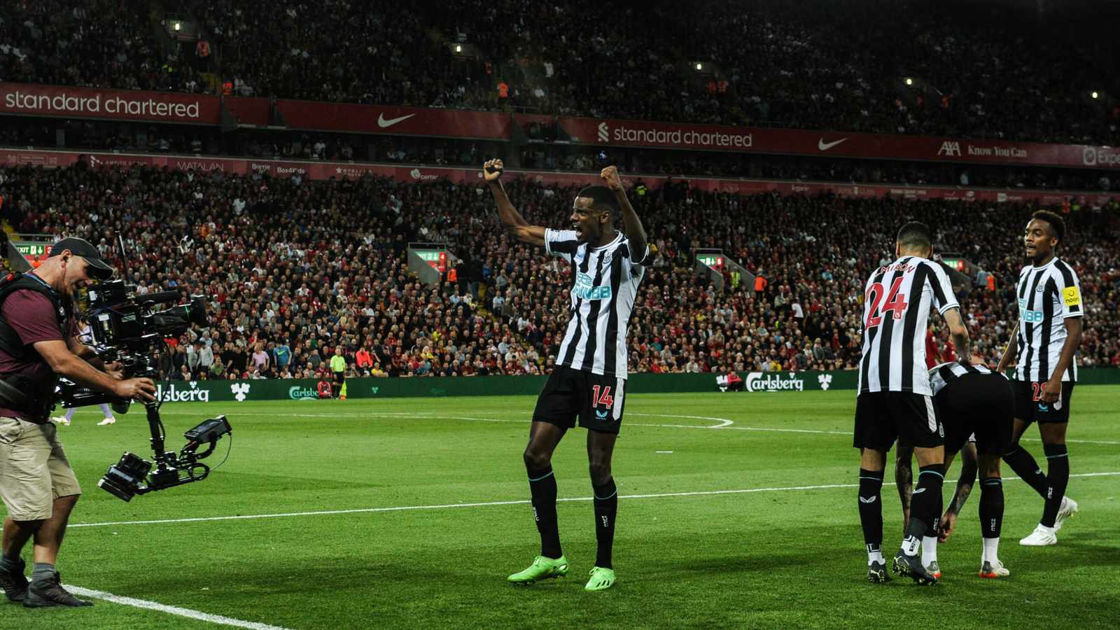 Alexander Isak running on a football pitch
