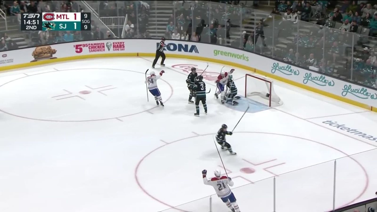 Kirby Dach reaches for puck