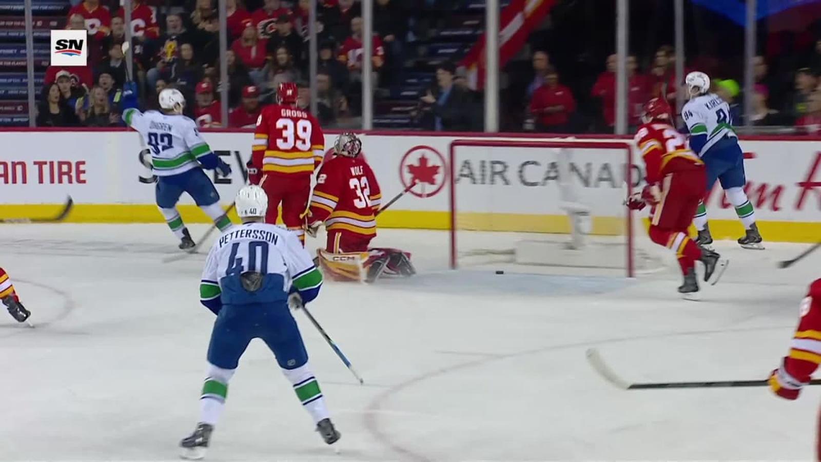 Dustin Wolf wearing Flames jersey