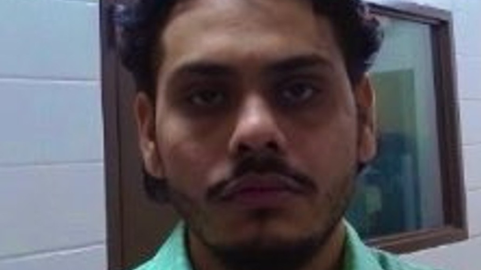 ICE agent apprehending a person