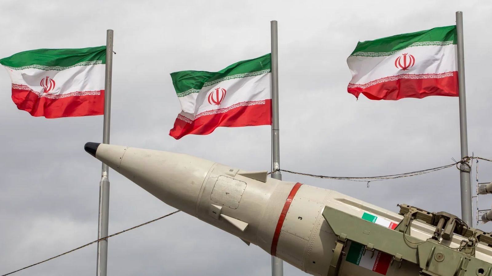 Irans IRGC symbol and warning text