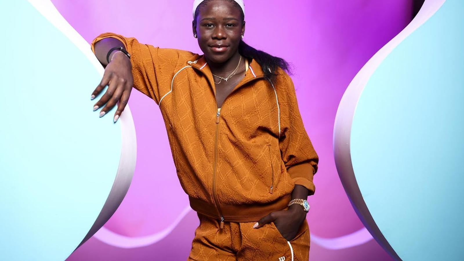 Victoria Mboko holding tennis racket