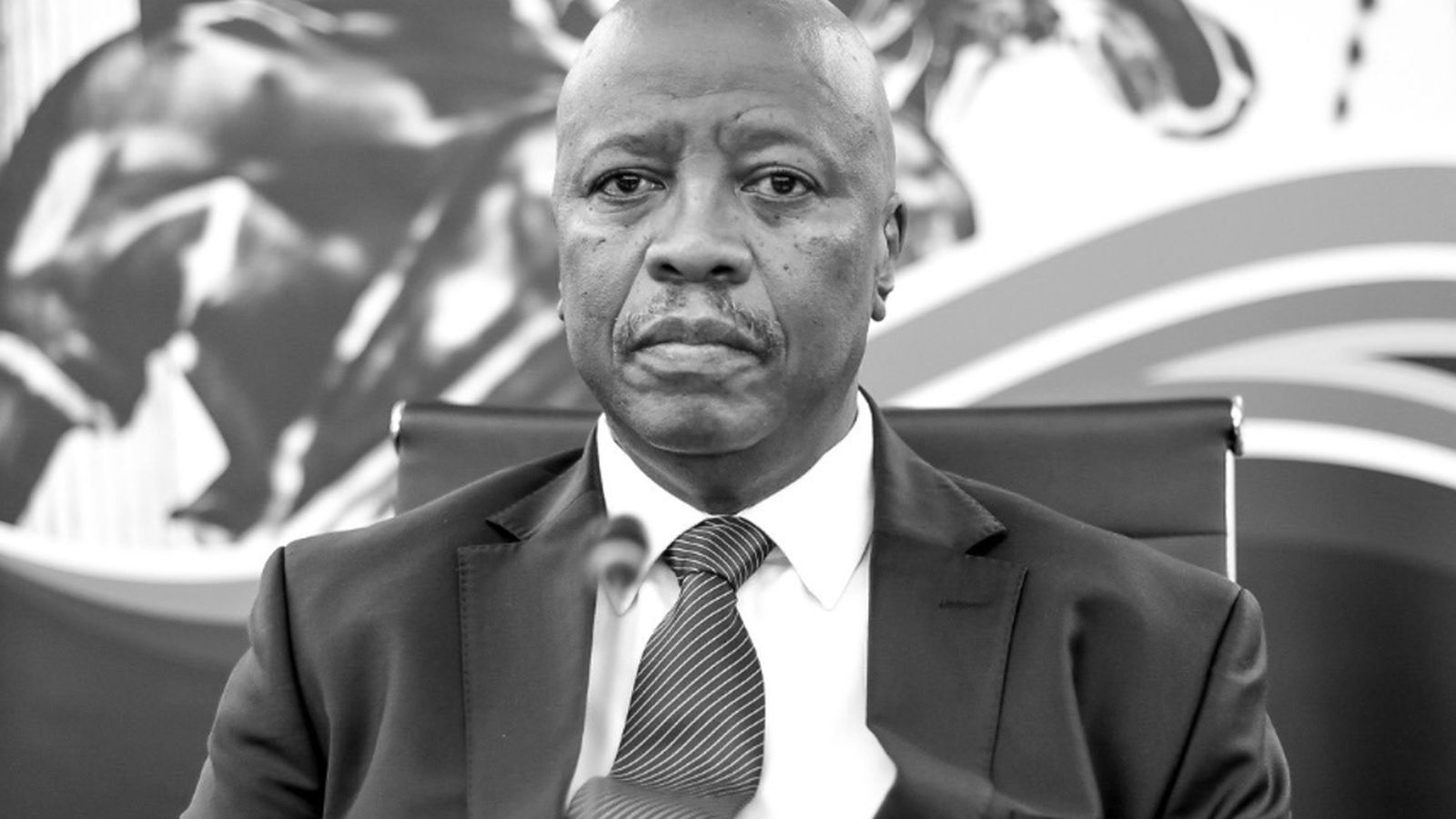 Portrait of Acting Judge President Aubrey Ledwaba wearing a suit and tie