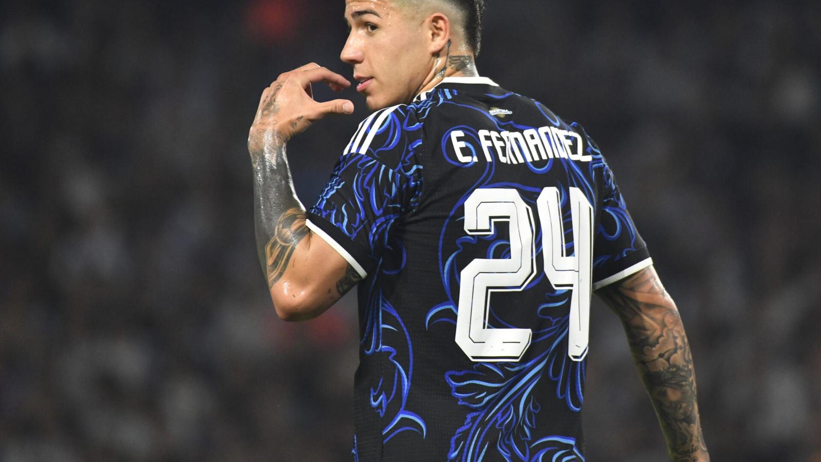 Enzo Fernandez wearing a black and blue Chelsea jersey with number 24