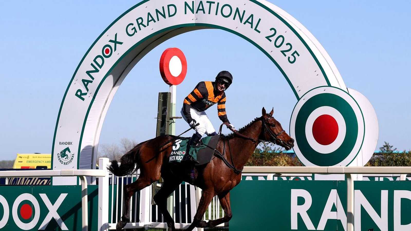 Racehorses jumping at Aintree