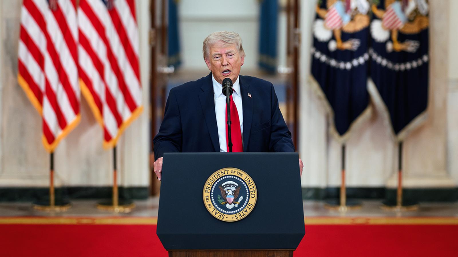 President Trump speaking at a podium