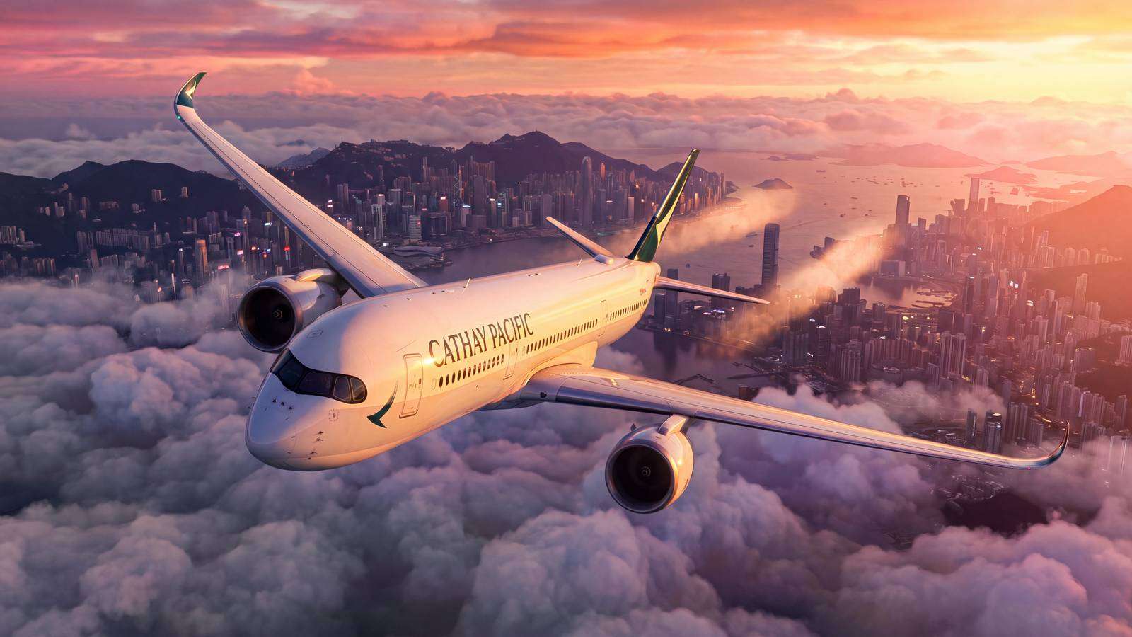 A Cathay Pacific airplane flying above clouds over Hong Kong city at sunset