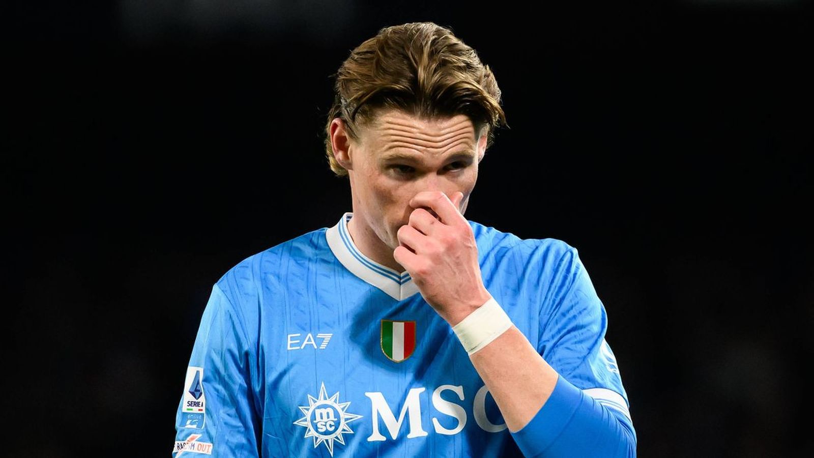 Scott McTominay wearing a light blue Napoli football jersey during a match