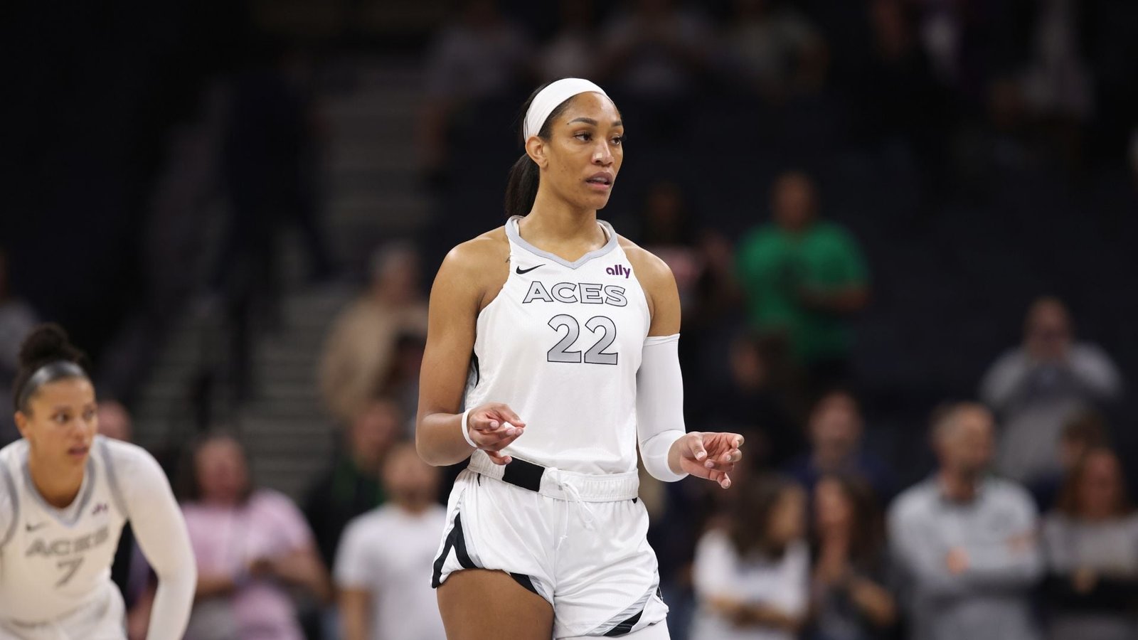 Aja Wilson wearing a white Las Vegas Aces jersey on the basketball court