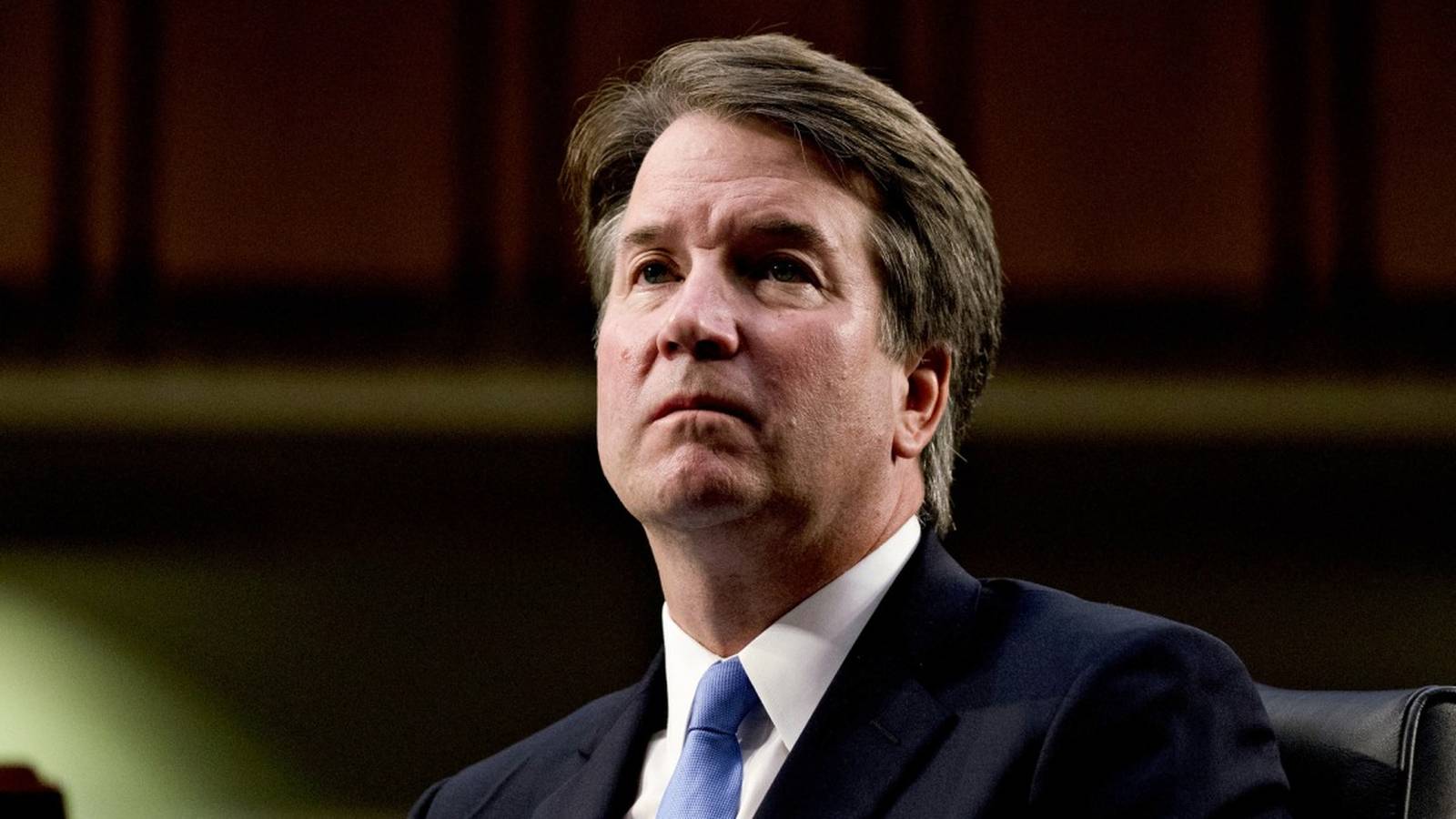 Supreme Court Justice Brett Kavanaugh looking upward during a formal Senate confirmation hearing