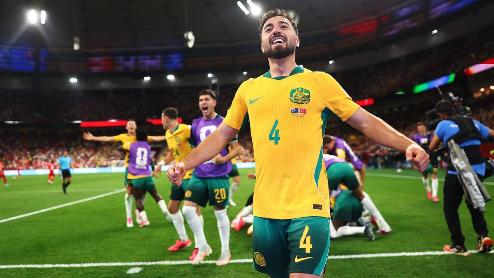Australian defender Cameron Burgess celebrating a goal during a professional football match