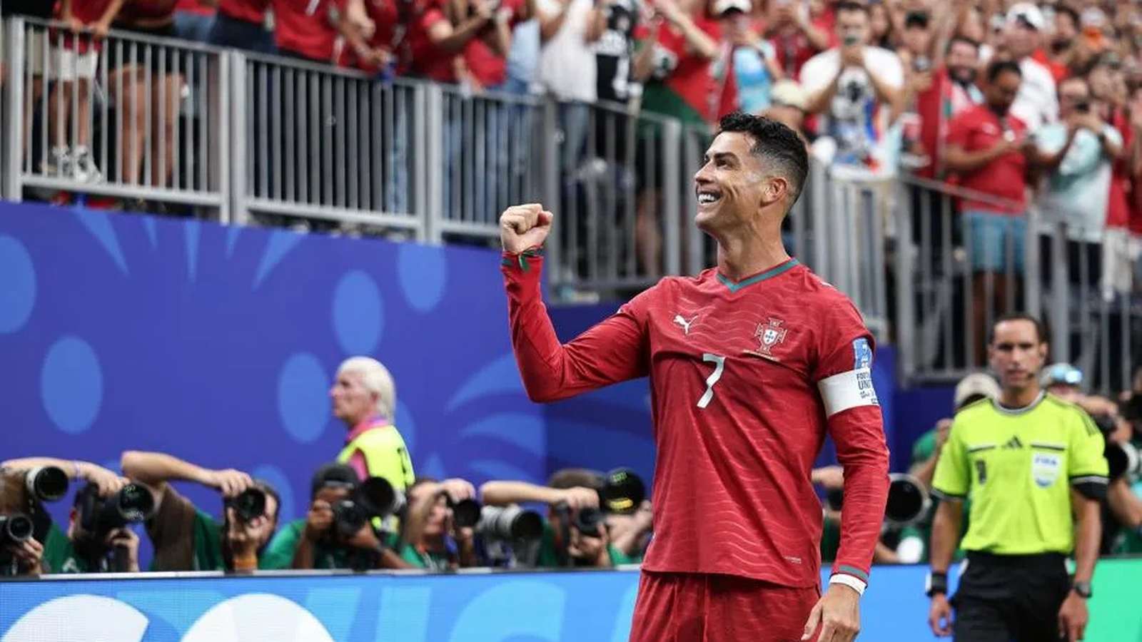 Cristiano Ronaldo celebrating a goal while wearing the red Portugal national team jersey