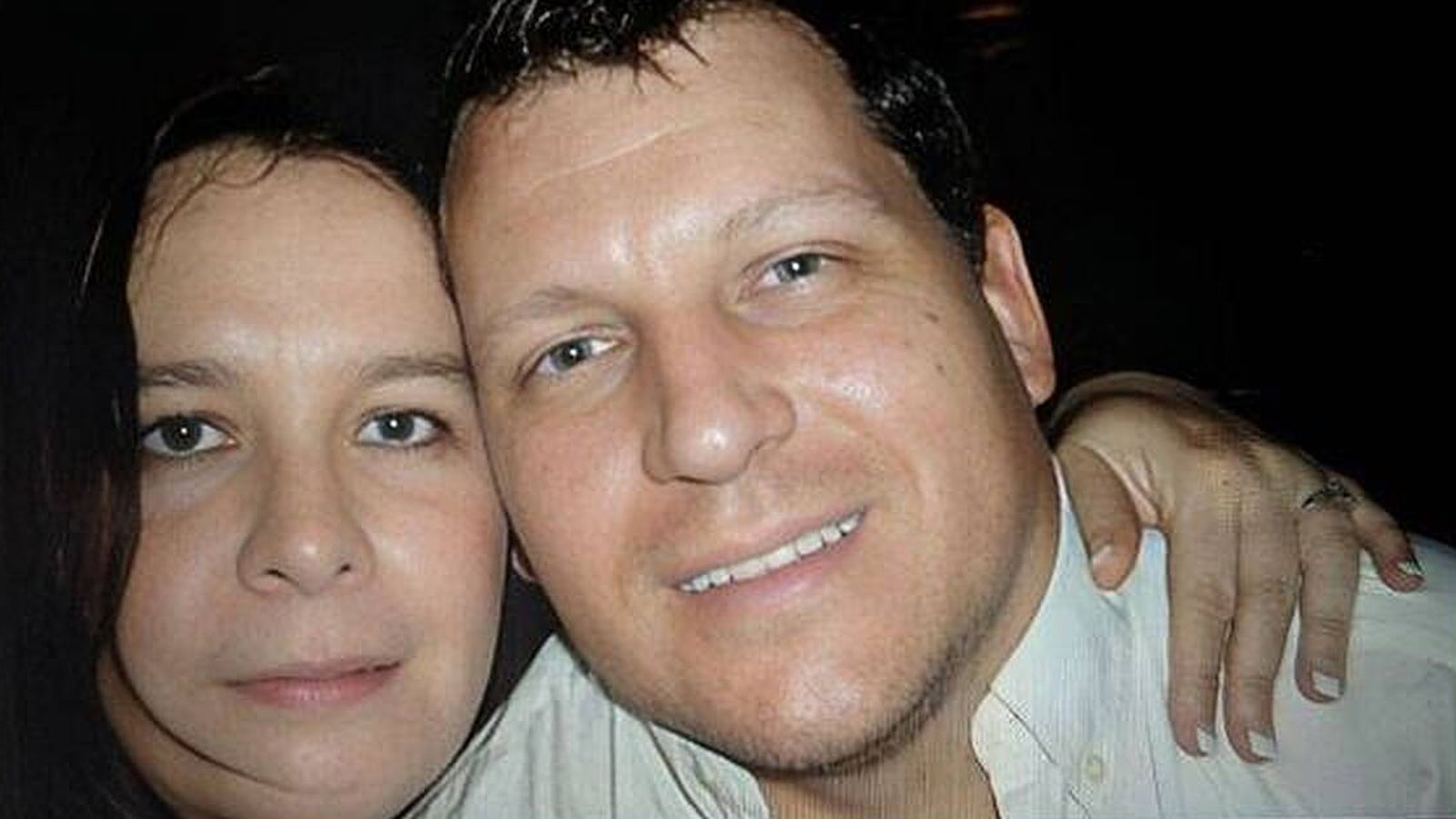 Desree Pether posing closely for a portrait with her husband Robert Pether