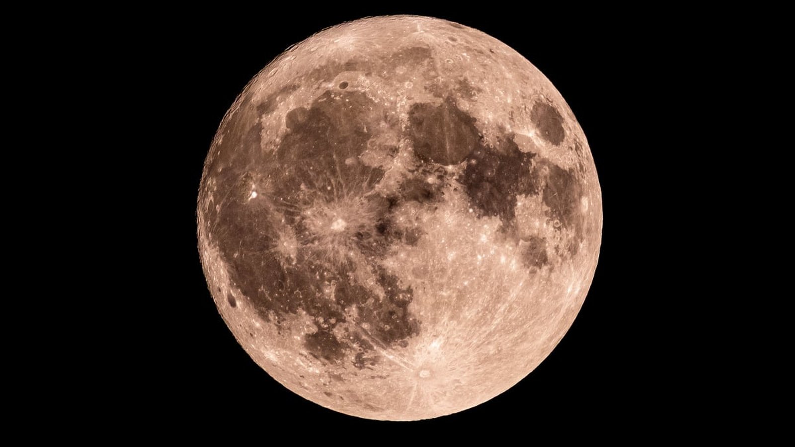 A detailed view of the full moon showing craters and lunar maria