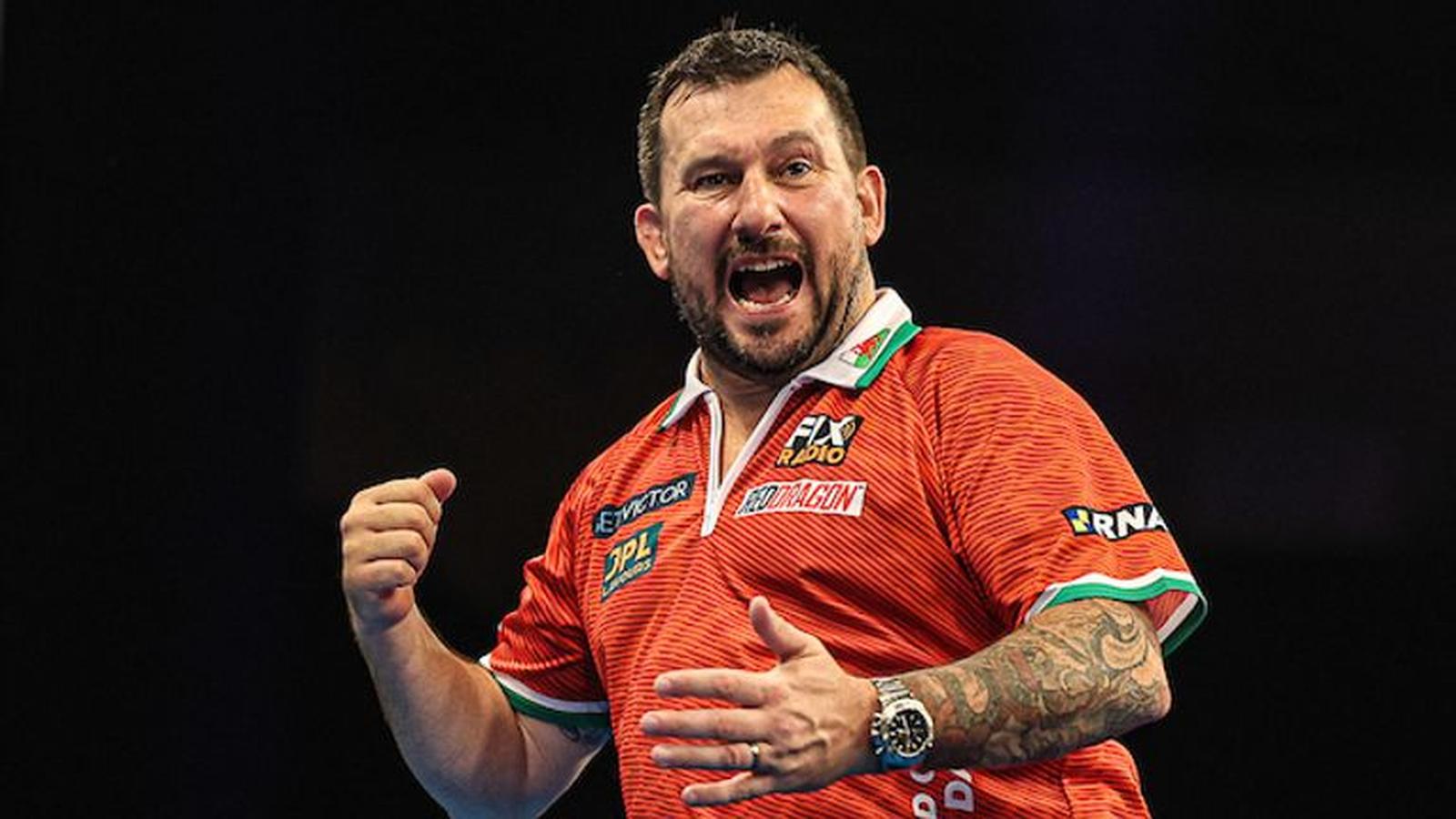 Professional darts player Gerwyn Price celebrating with a fist pump during a match