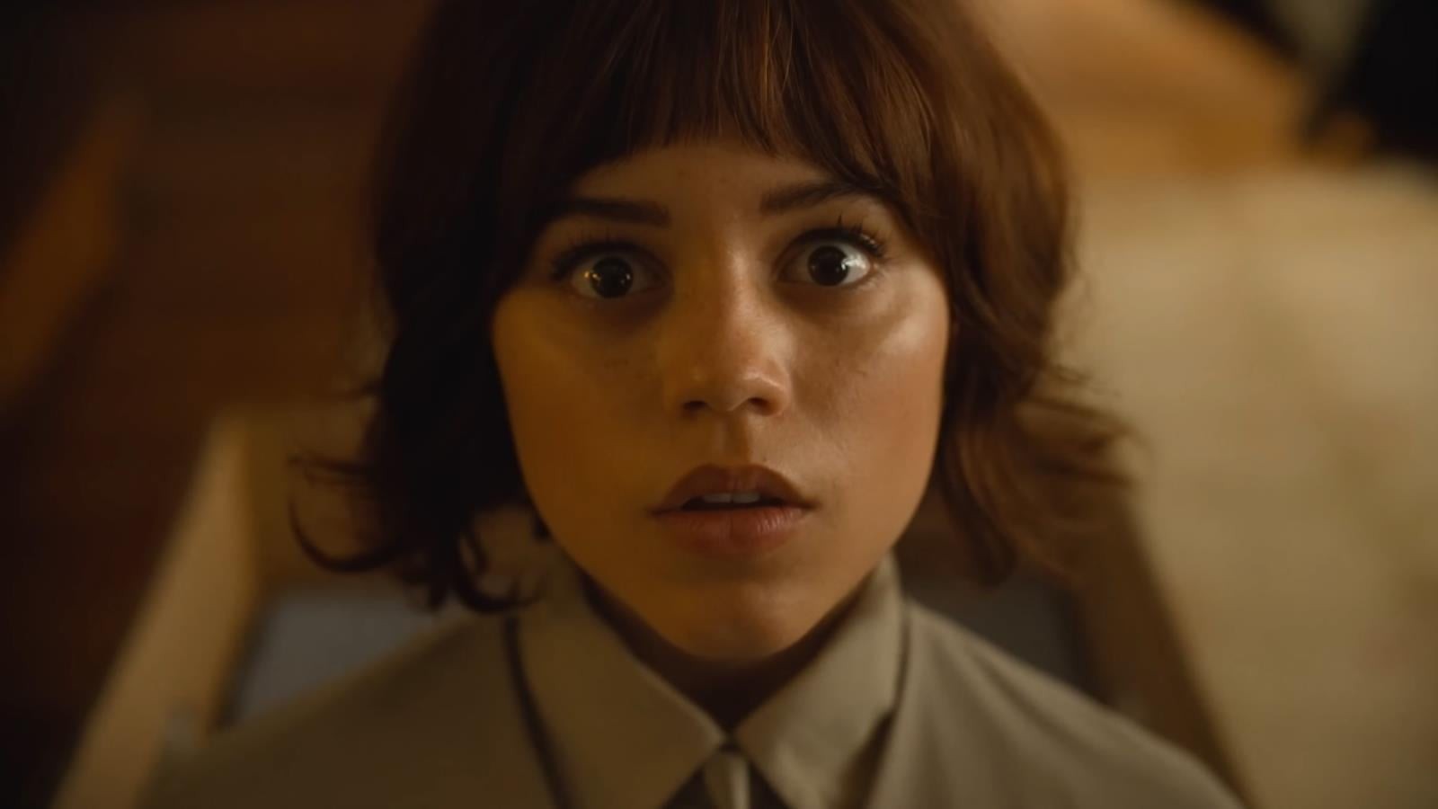 Jenna Ortega with a bob haircut looking surprised in a scene from Klara and the Sun