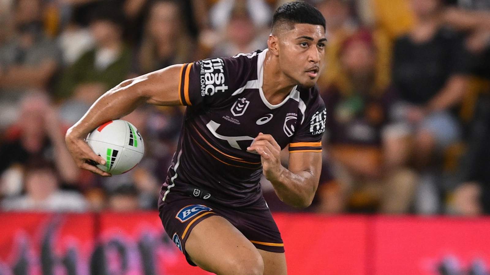 Brisbane Broncos winger Josiah Karapani running with the ball during a rugby match