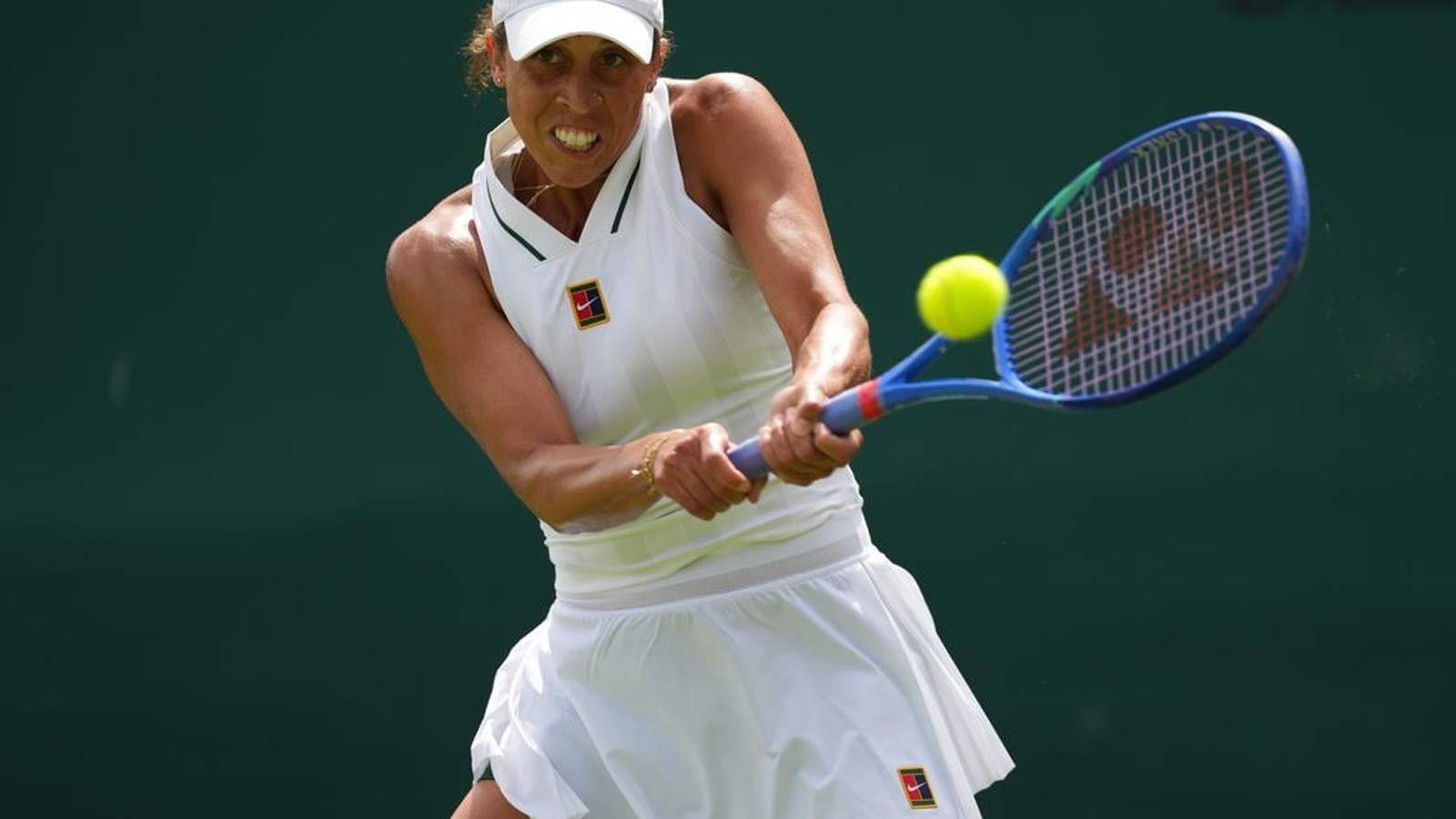 Kayla Day hitting a tennis ball during a match at the Wimbledon championships