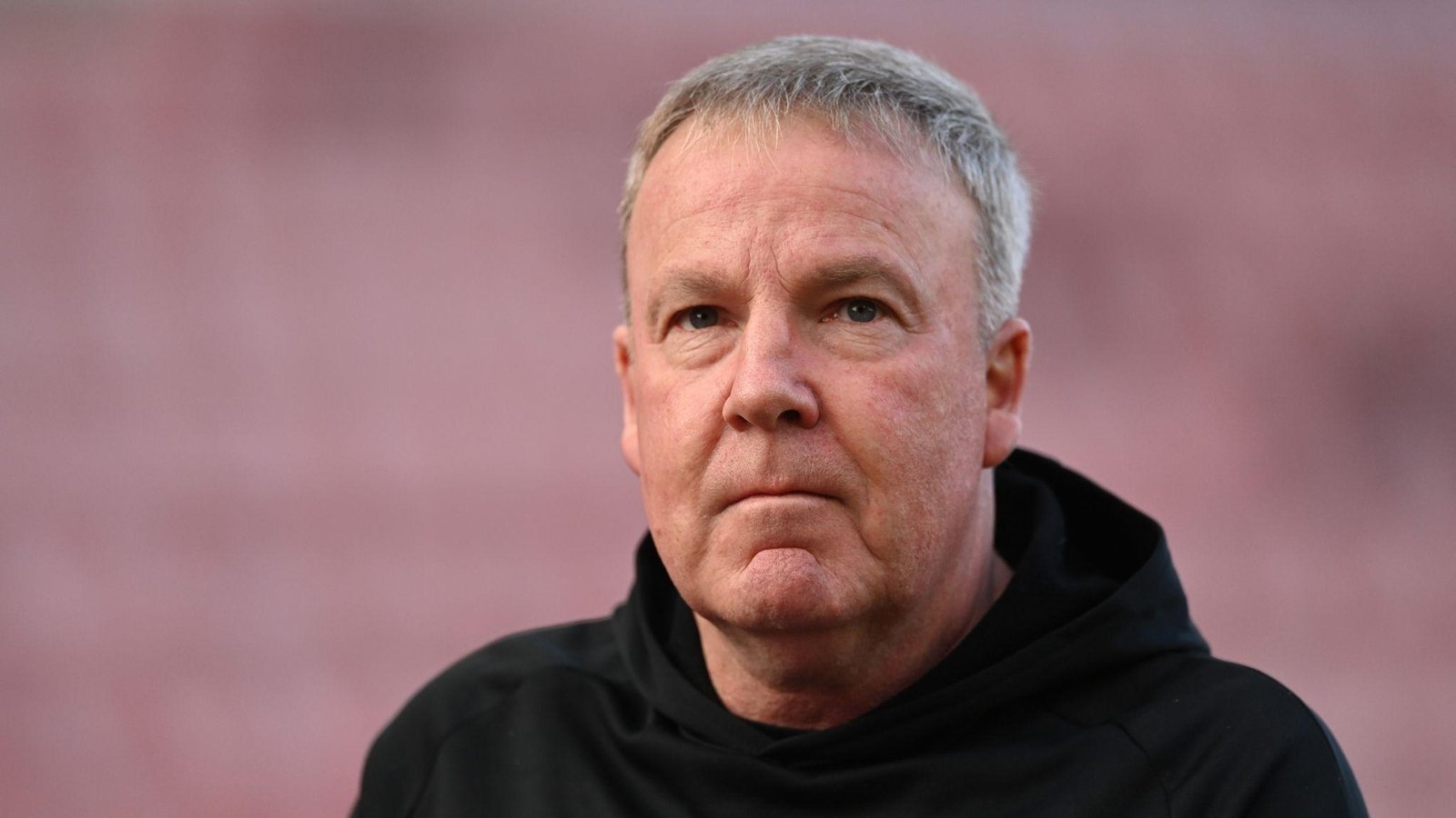 Close up portrait of football manager Kenny Jackett wearing a black hoodie