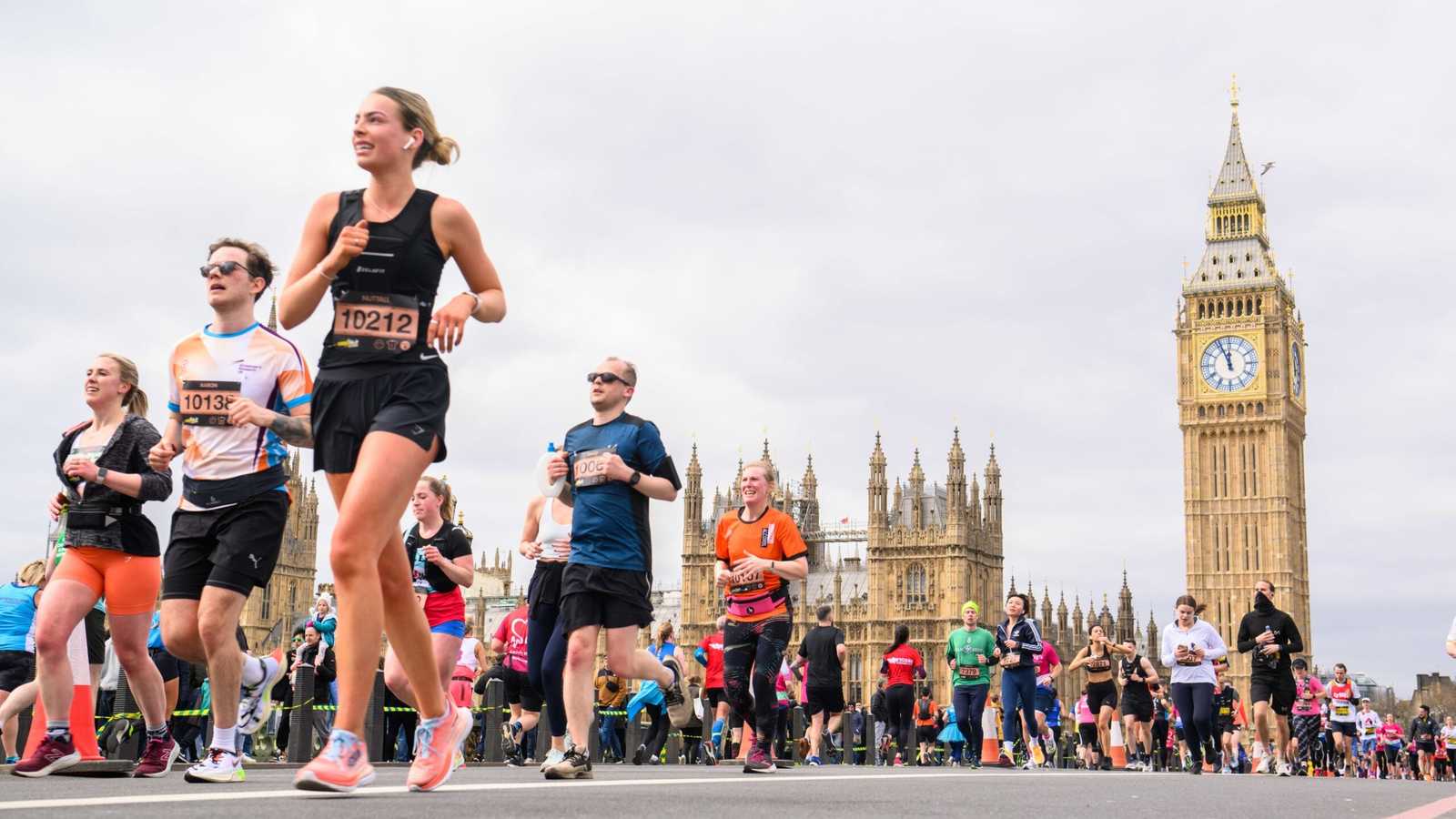 Group of runners participating in the London Marathon with Big Ben in the background