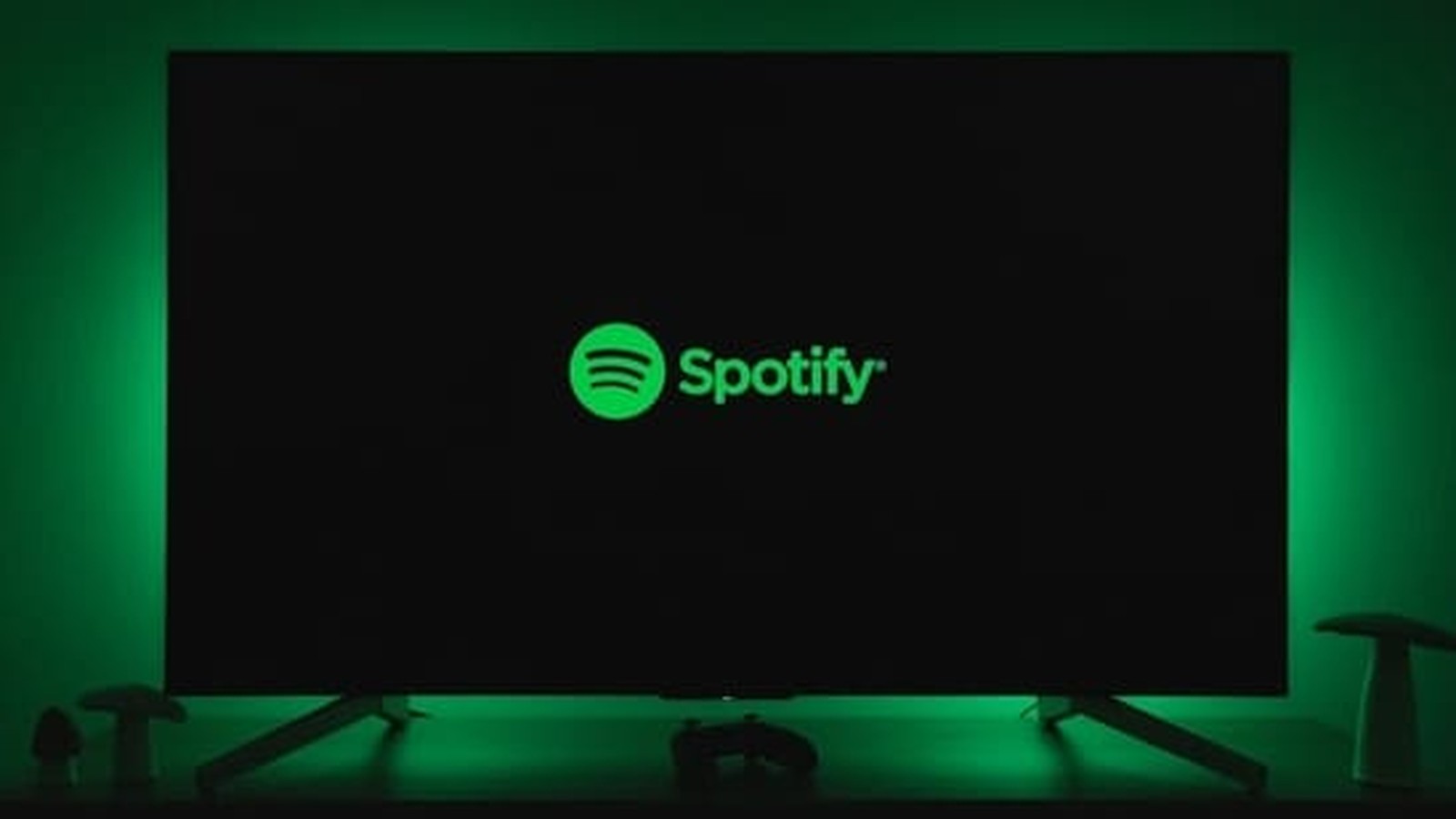 The green Spotify logo displayed on a dark television screen with ambient lighting