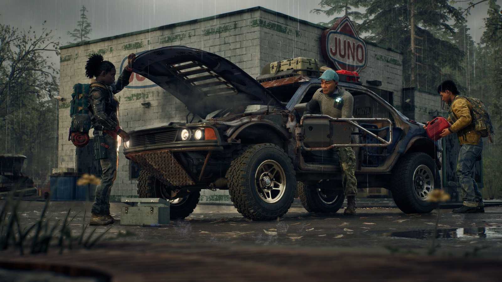Three survivors repairing a modified vehicle outside a rainy Juno gas station