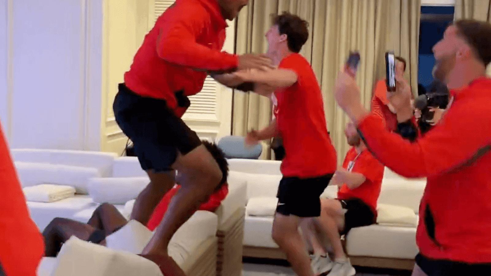 Tyler Adams jumping excitedly while celebrating a New York Knicks game comeback victory