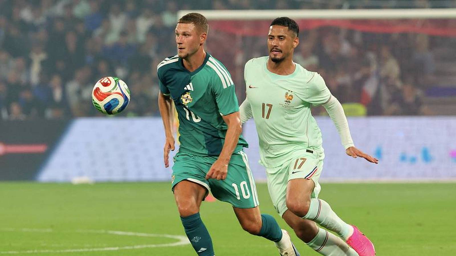 William Saliba in a France jersey running on the pitch during a match