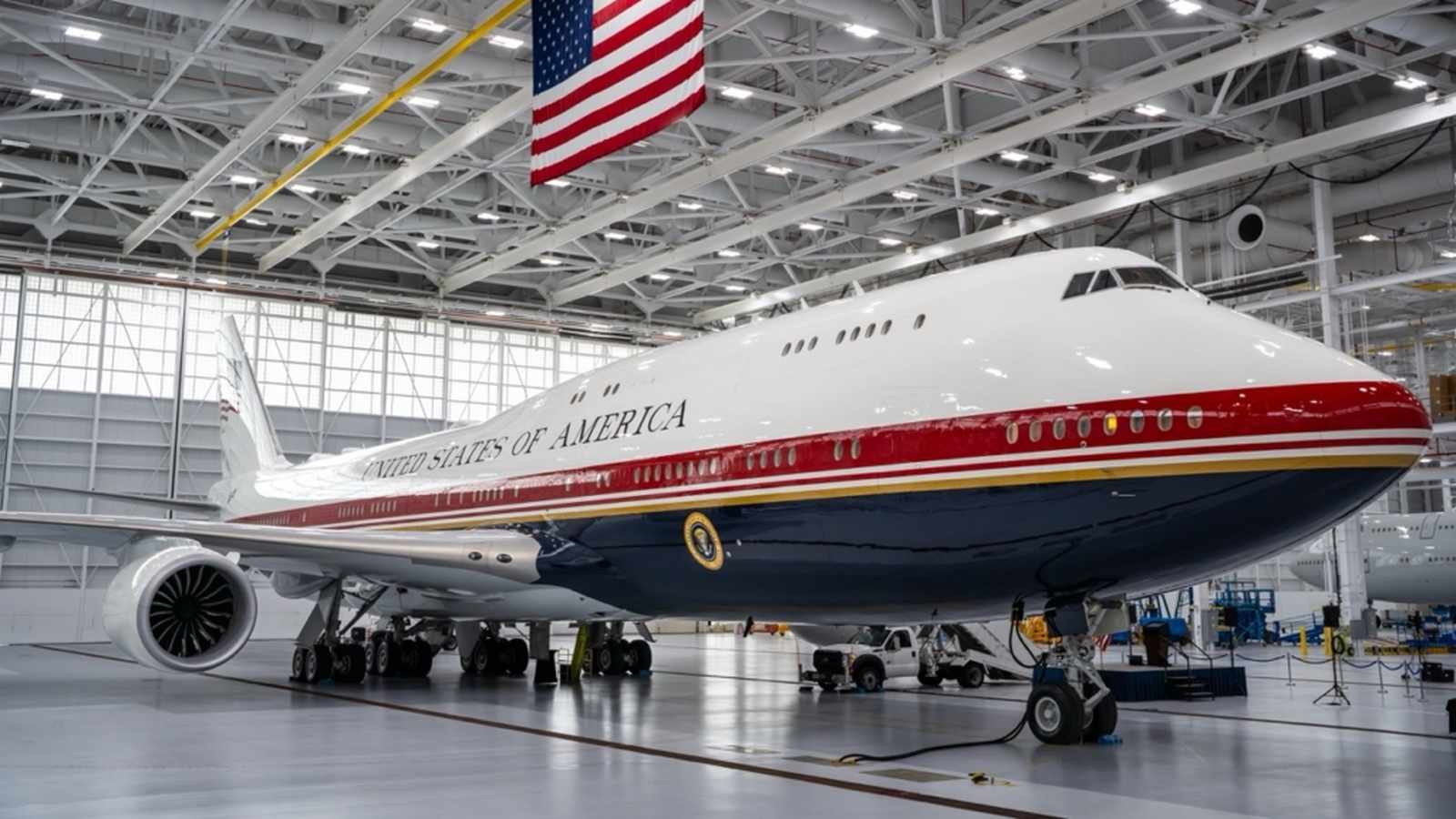 A Boeing 747-8 aircraft with United States of America livery parked inside a hangar