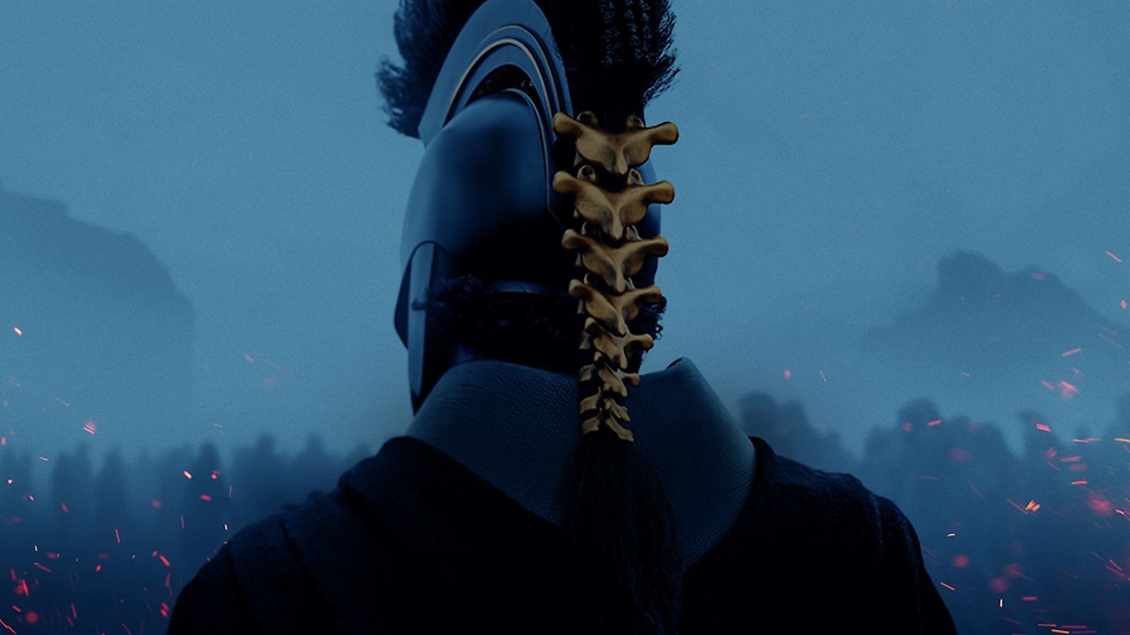 A warrior wearing a dark helmet with a golden spine ornament facing away