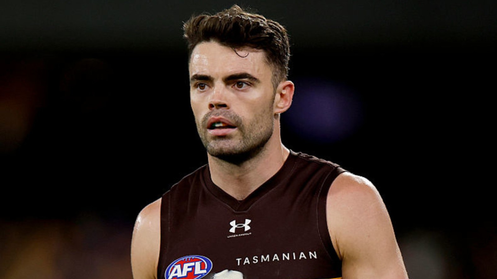 Hawthorn midfielder Conor Nash wearing his brown and gold team jersey during a match