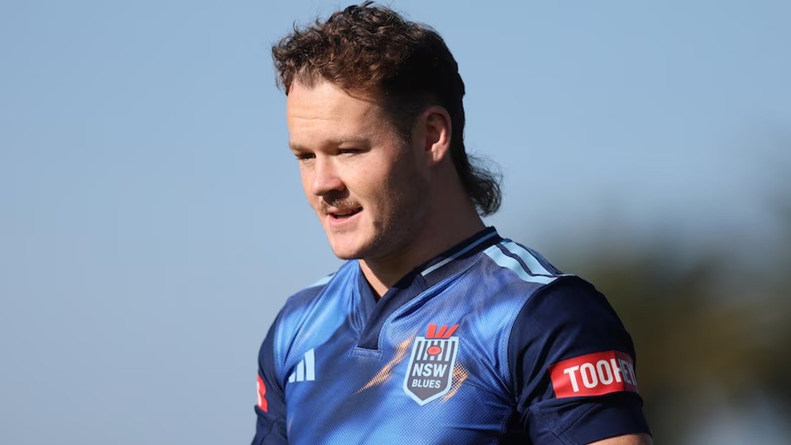 Ethan Strange wearing a blue NSW Blues rugby jersey during a training session