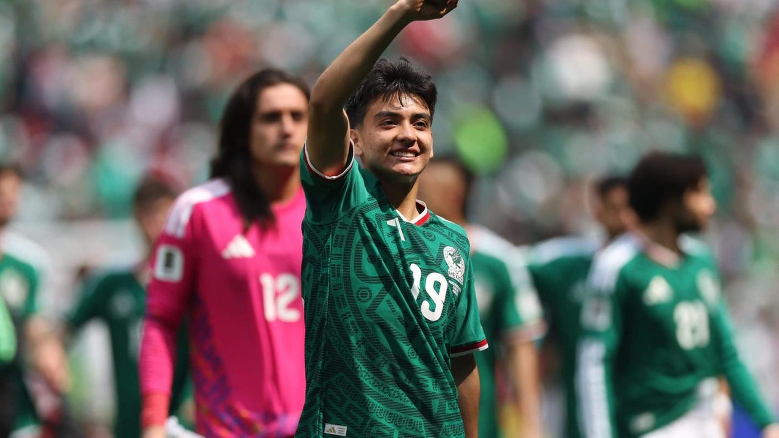 Young Mexican football player Gilberto Mora celebrating on the pitch in green jersey