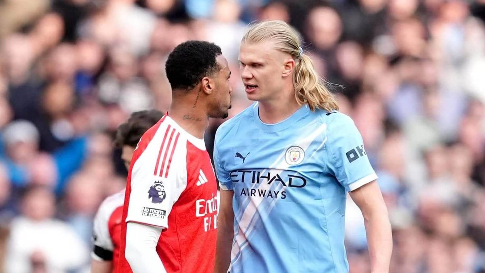 Erling Haaland and Gabriel Magalhaes confronting each other during a Premier League football match