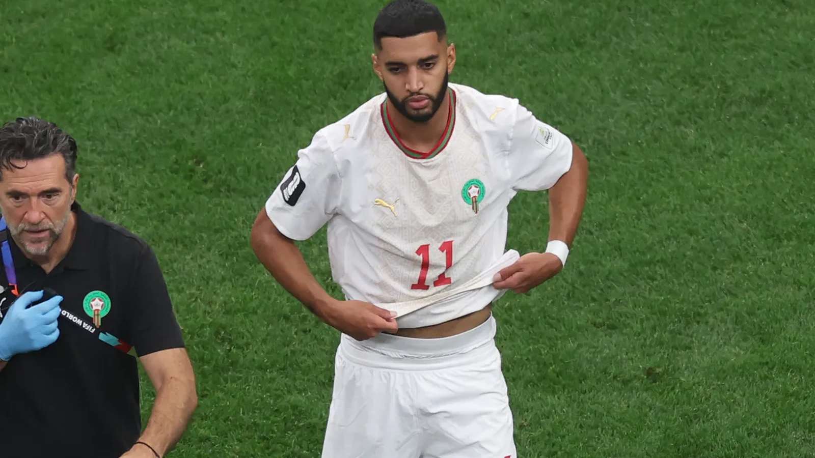 Moroccan midfielder Ismael Saibari looking distressed while wearing his white national team jersey