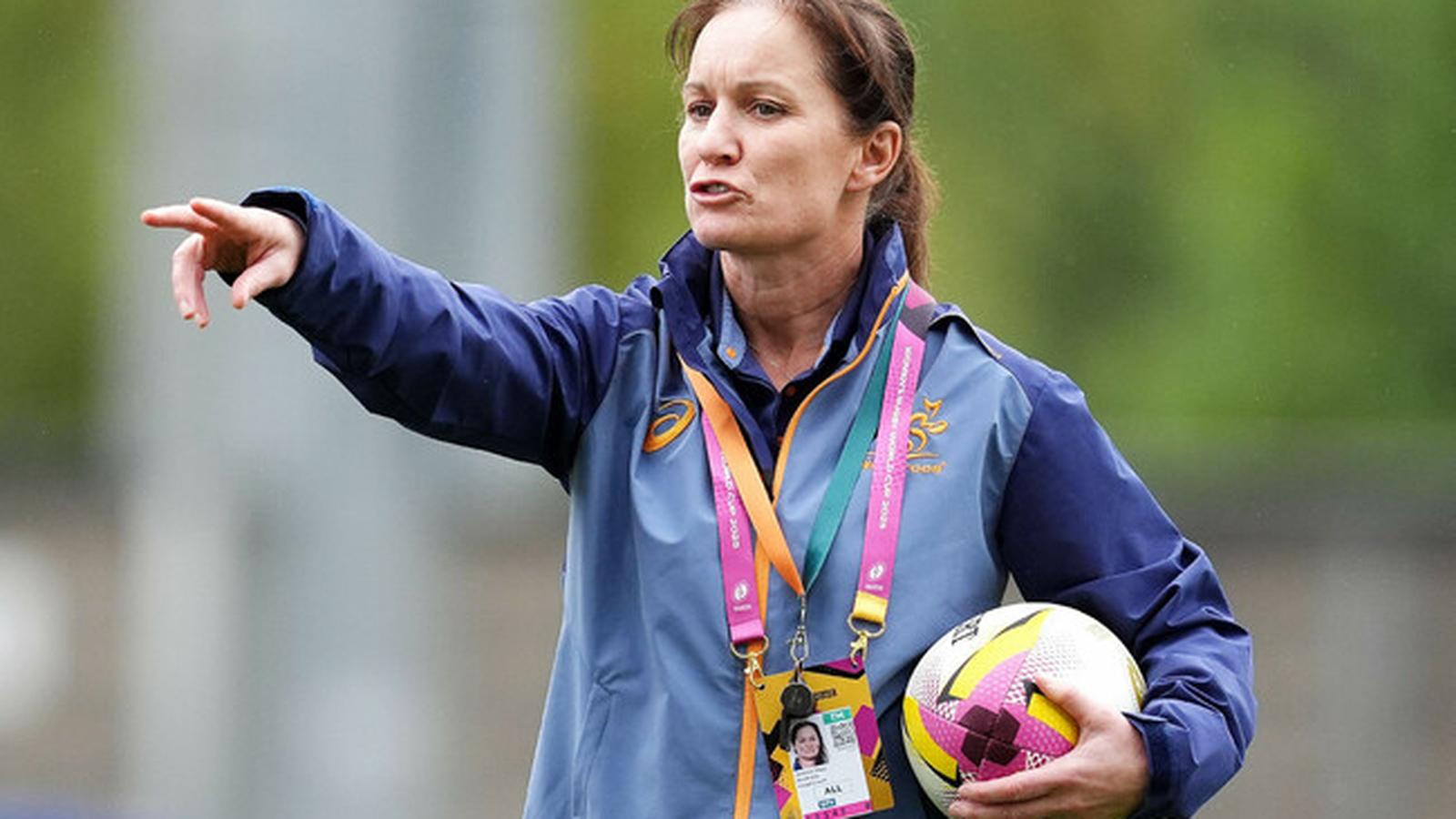 Jo Yapp gesturing while coaching on a rugby pitch holding a ball